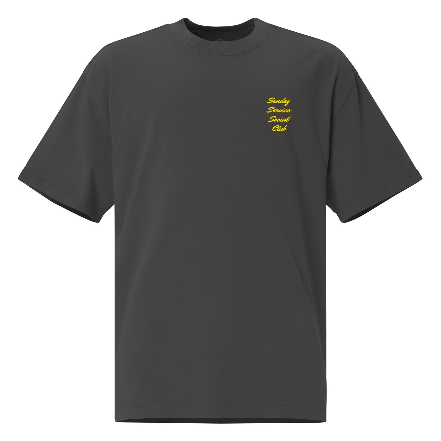 Front of a black t-shirt with the words 'Sunday Service Social Club' printed in large, bold, yellow cursive font. The text is stacked vertically in four lines, creating a vibrant and eye-catching design against the black background.